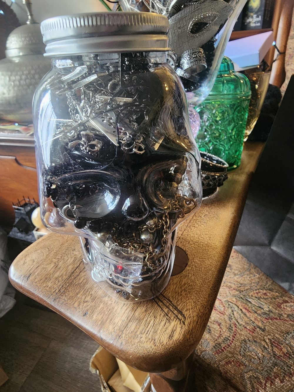 Clear Skull Jar Filled with Black Jewelry